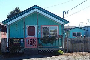 Blue house with pink trim
